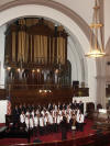 Conductor and organist Mrs. Sherrylyn Waldron dynamically leads the large choir.
